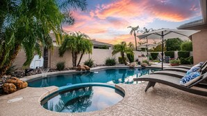 A swimming pool with lounge chairs and a basketball hoop. - Lynx Chandler/ocotillo (Chandler)