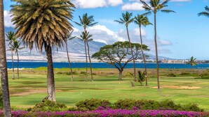 A golf course with a view of the ocean and mountains in the background. - Charming 2-bedroom condo in delightful Kihei with AC, WiFi Luana kai C101 (Kihei)