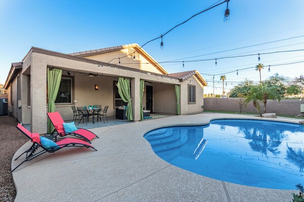 A house with a swimming pool, outdoor furniture, and a covered patio area. - Merino Mesa (Mesa)