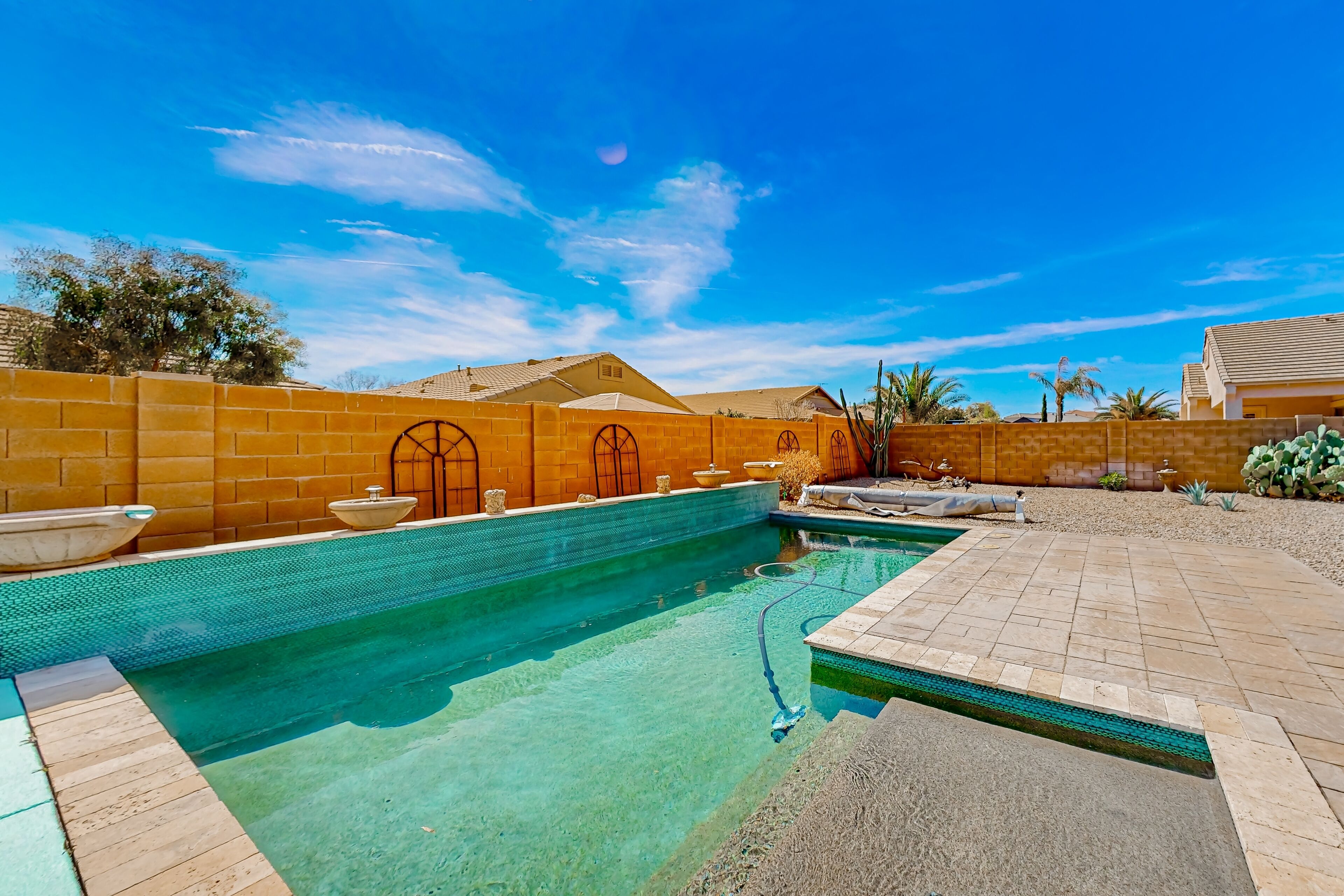 Sparkling desert oasis with enclosed yard, private pool, washer/dryer, & AC