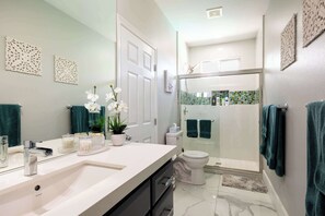 Shower, hair dryer, towels