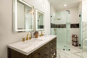 Shower, hair dryer, towels, shampoo