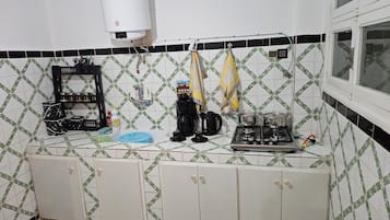 Fridge, coffee/tea maker, electric kettle, toaster