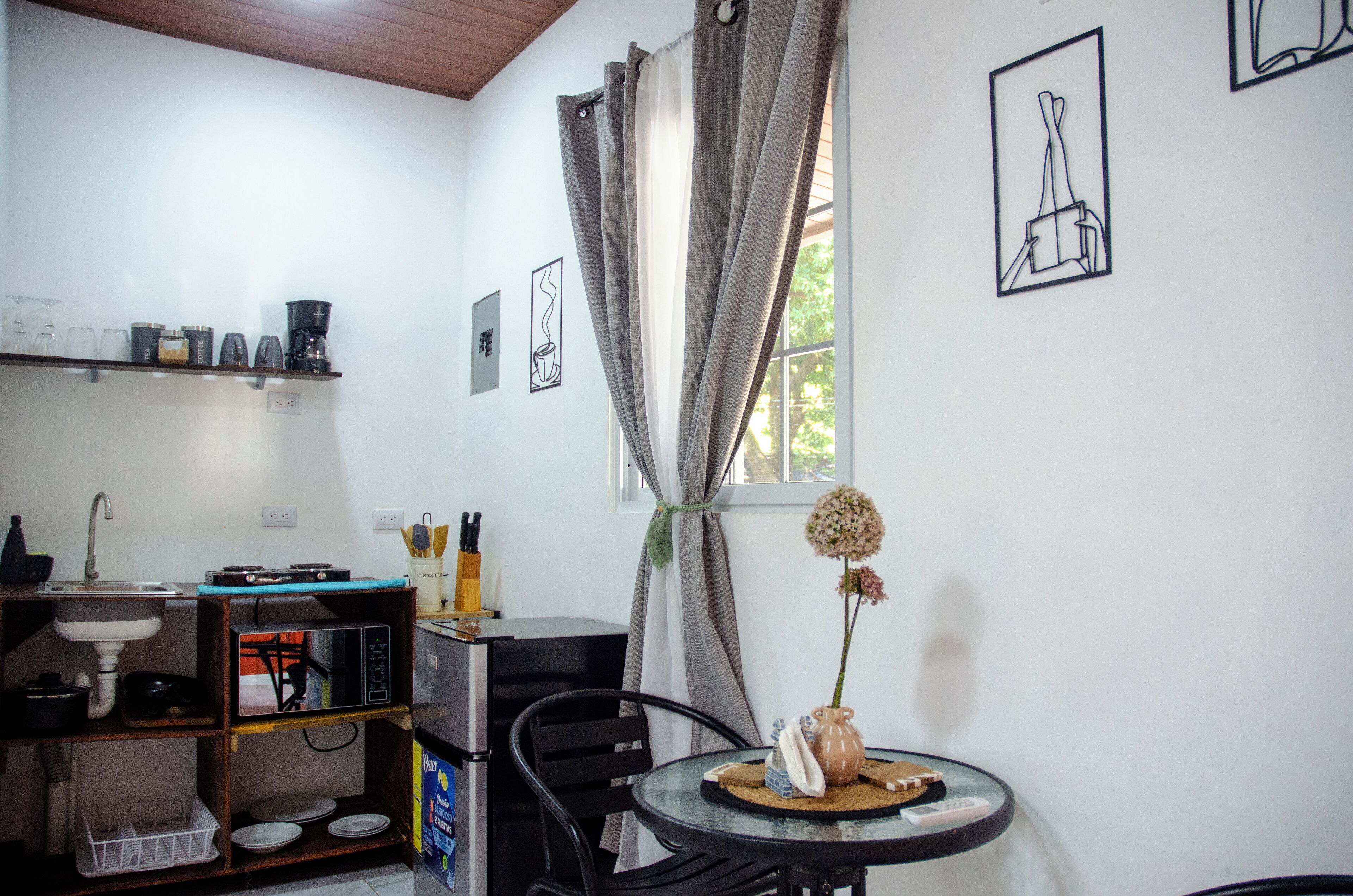 Fridge, microwave, stovetop, coffee/tea maker