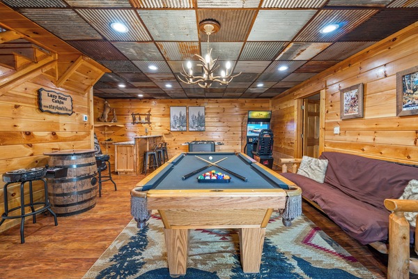 Luxury game room with sit down driving game, foosball & whiskey barrel arcade!