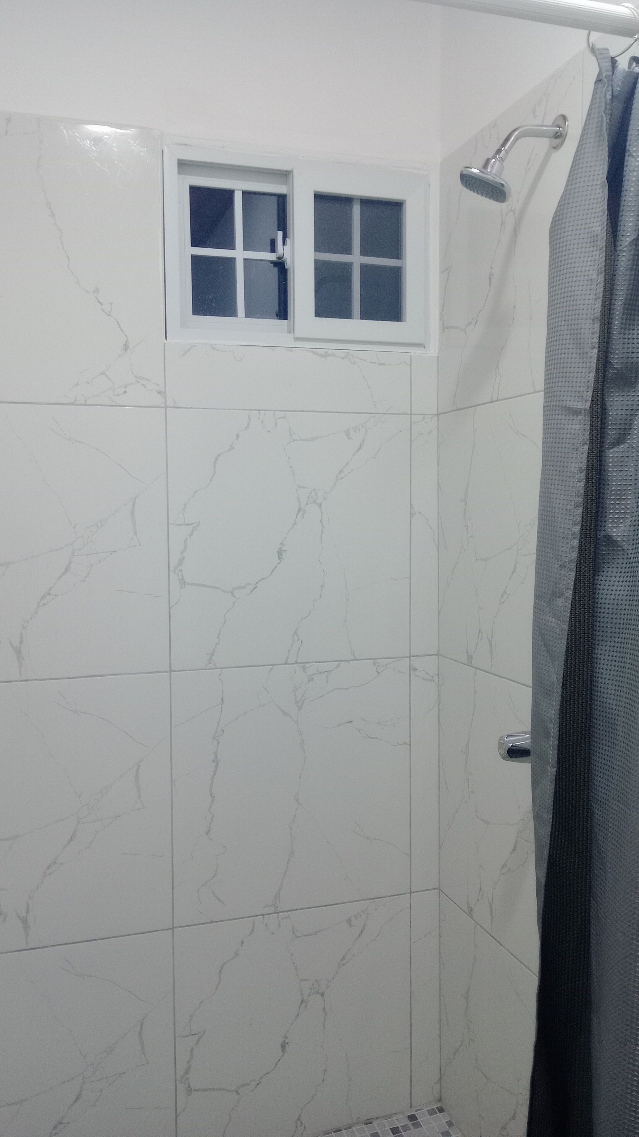 Comfort Apartment, 1 King Bed, Beachside | Bathroom | Shower, towels, soap, shampoo