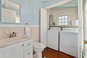 Shower, hair dryer, towels, shampoo