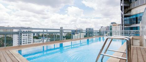 Outdoor pool, open 6:00 AM to 9:00 PM, pool loungers