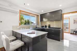 Fridge, microwave, oven, stovetop - Spacious Family Home with Views (Lutana)