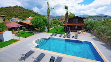 Seasonal outdoor pool, open 8:30 AM to 6:30 PM, pool umbrellas