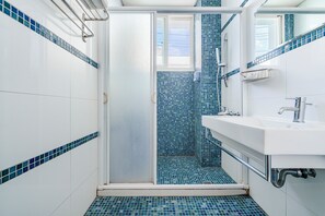 Standard Double Room | Bathroom | Hair dryer, slippers, towels, shampoo