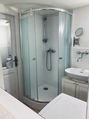 Shower, hair dryer, towels, soap