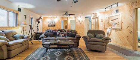 Signature House, Patio, Mountain View | Living room | 65-inch Smart TV with cable channels, DVD player, books