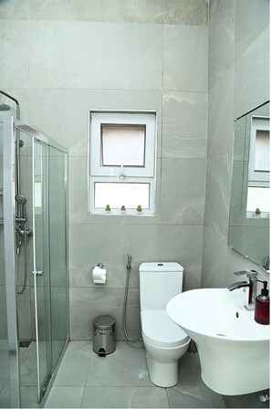 Shower, hair dryer, towels, soap