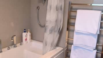 Jetted tub, hair dryer, towels, soap