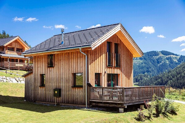 Enjoy a scenic view from the cabin's spacious balcony with a railing.