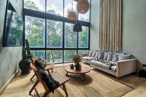 Luxury Penthouse, 2 Bedrooms, Private Pool, Park View (Attha C3 - Nirvana) | Living area | 55-inch Smart TV with digital channels, Netflix, books - BT Homes - Wellness Jungle (Tulum)