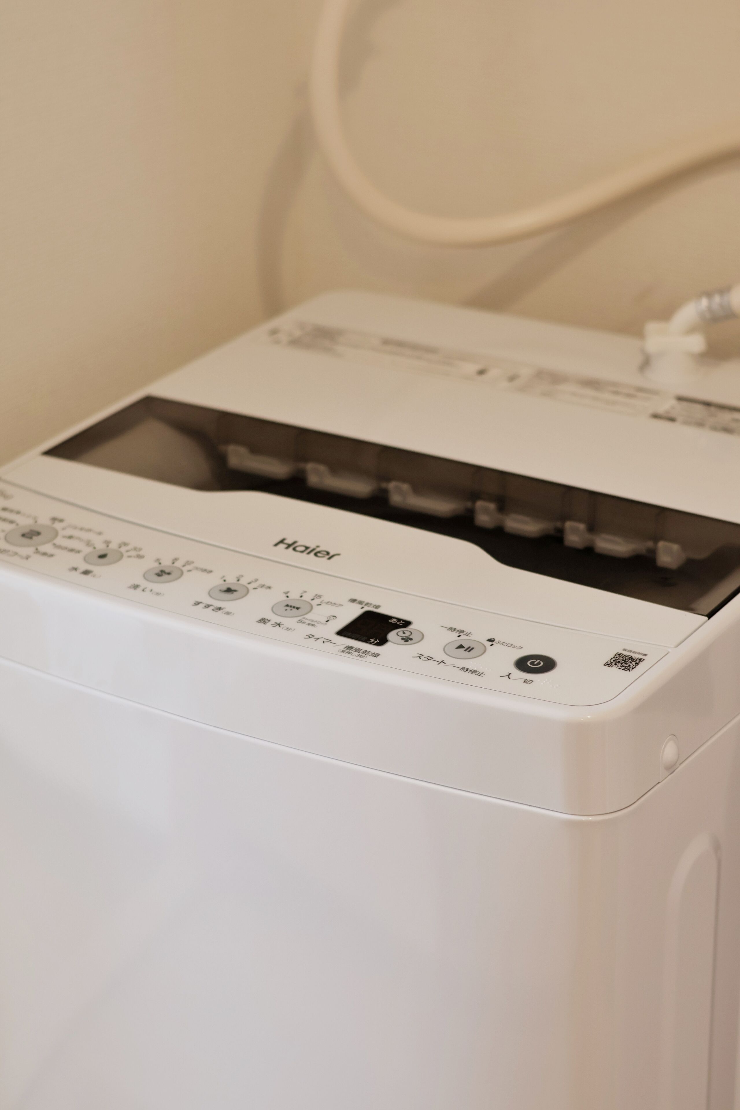 A white printer with multiple control buttons and a paper output tray.