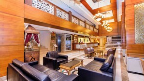 A spacious lobby with leather sofas, a reception desk, and a kitchen area. - Baron Hotel & Spa (Istanbul)