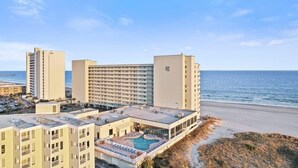 A hotel with a rooftop pool, beachfront location, and multiple buildings. - Direct Ocean View - Exclusive Sand Beach Club 2BR (Myrtle Beach)