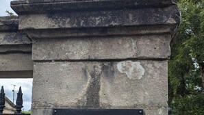 A stone pillar with a black sign that reads "Drenagh." - Plantation Drive - Home from home (Limavady)