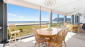 A spacious balcony with a view of the beach and ocean. - Sand & Sea (402) Water's Edge Panoramic Views (Seaside)