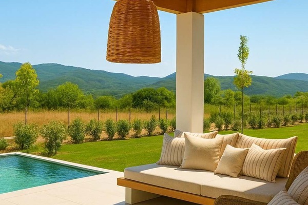 Shaded poolside lounge with countryside view
A quiet and stylish corner to relax under the pergola beside the pool, surrounded by nature.