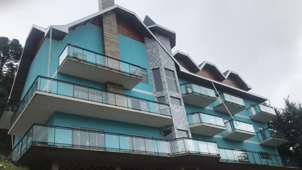 A multi-story building with balconies and a central stairwell.