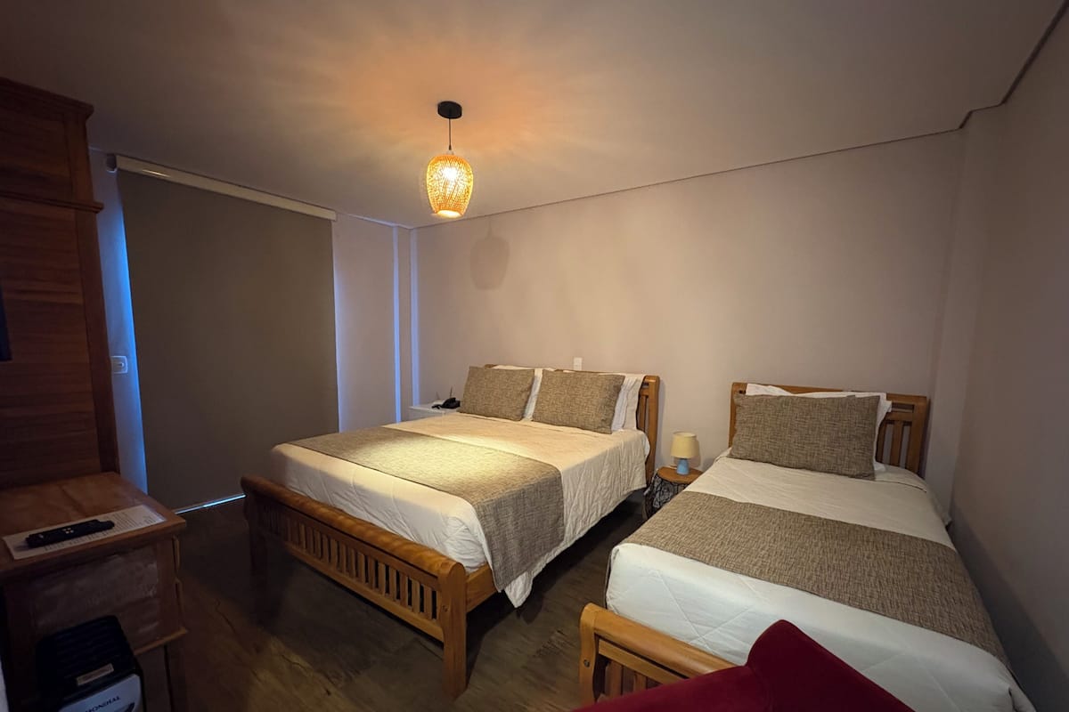 Deluxe Triple Room, Mountain View, Ground Floor | Premium bedding, minibar, desk, laptop workspace