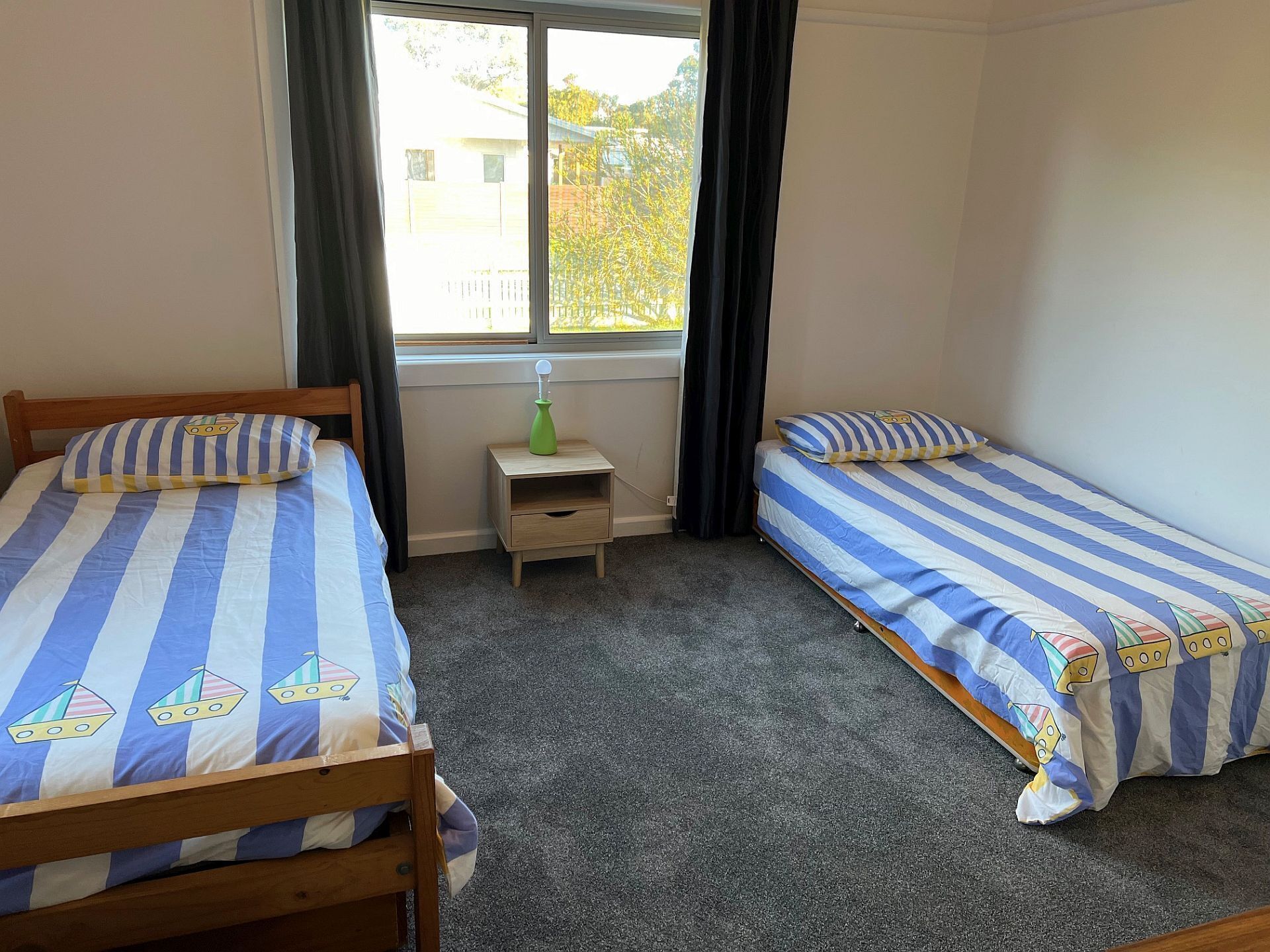 Bedroom 3, 3 x single beds, portable heater, carpeted, extra blankets