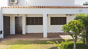 A building with a tiled roof, a sign reading "CASA ZELIA," and a small tree in the foreground. - Casa Z lia in Tavira (Tavira)