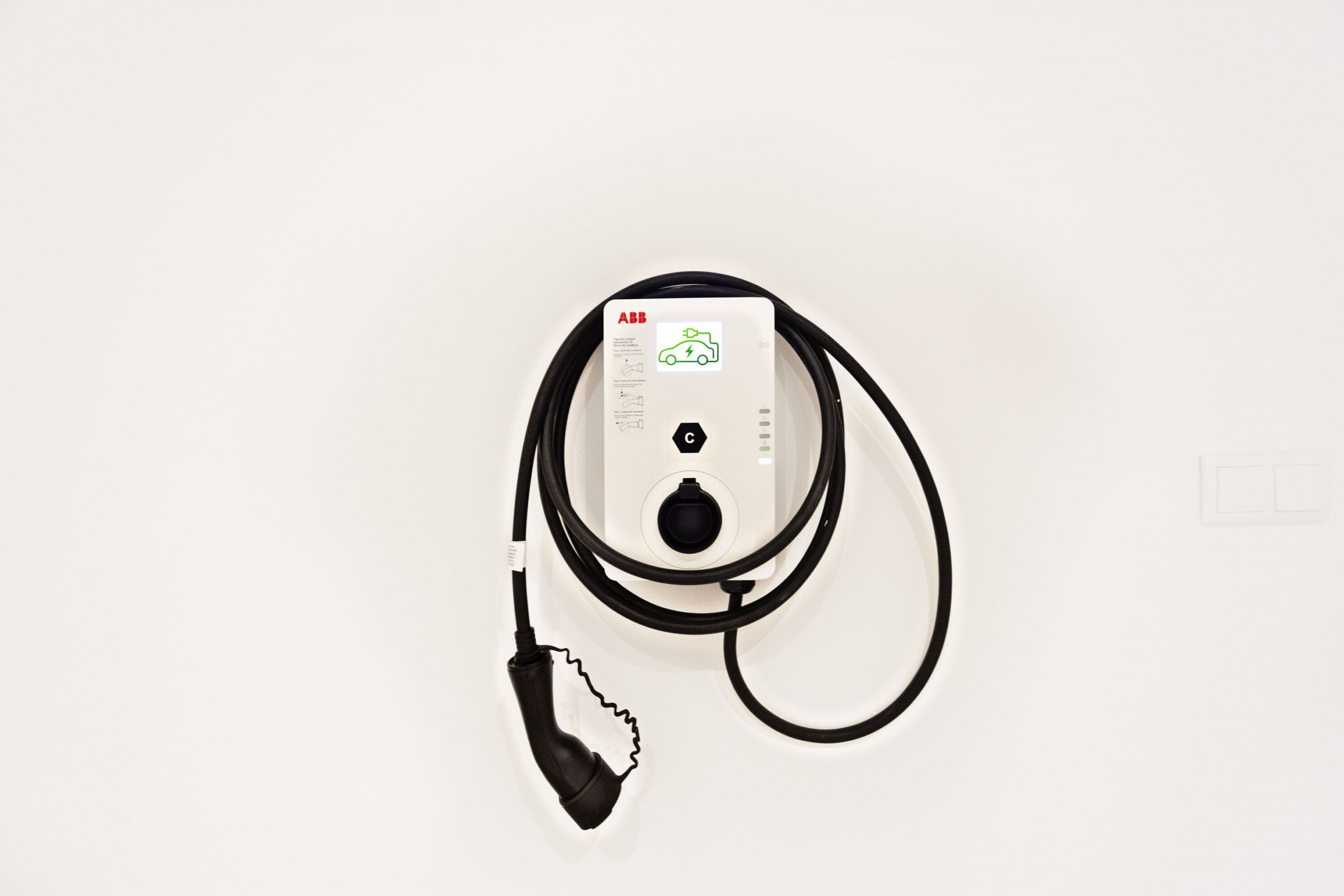 A portable charging station with a cable and a plug.
