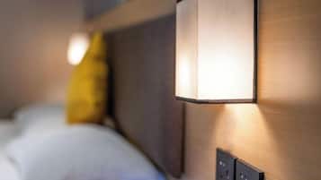 A wall-mounted light fixture with a rectangular shape and a visible switch below it.