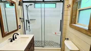 Shower, hair dryer, towels, soap