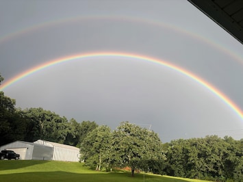 Double Rainbow over the hut in the summer time.