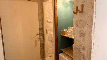 Classic Room, Courtyard View | Bathroom | Shower, slippers, towels, toilet paper