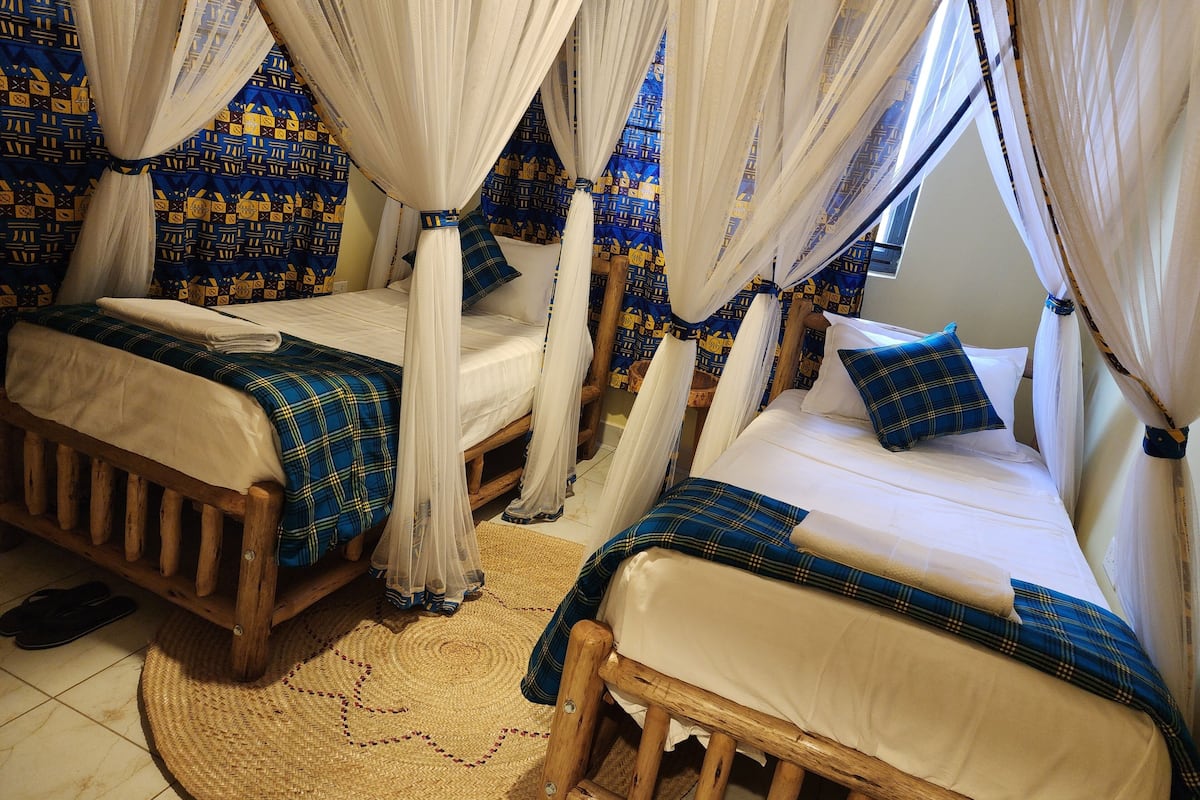 Hypo-allergenic bedding, down duvets, desk, laptop workspace