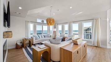 Smart TV, fireplace, books, stereo