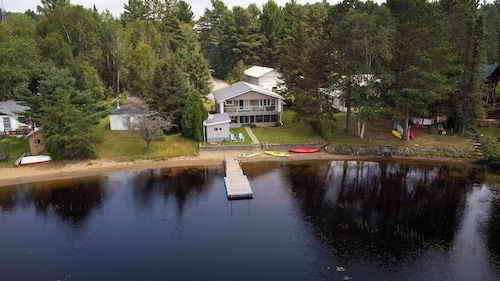 Four Season Serene Lake House with Stunning Lake Views, Private Dock and Sauna.