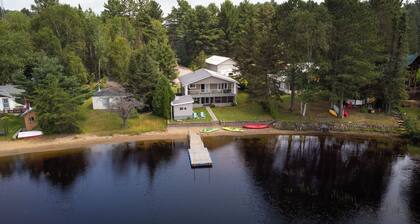 Four Season Serene Lake House with Stunning Lake Views, Private Dock and Sauna.
