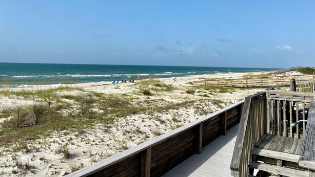 A wooden boardwalk leading to a beach with a clear view of the ocean. - Ocean Mile F-4, St. George Island, Community Pool, 2 BR (St. George Island)