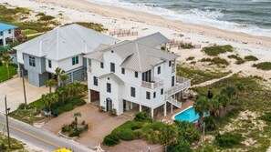 A two-story beachfront property with a swimming pool and a beach view. - Southern Splendor, BF, Private Pool, 5BR (St. George Island)