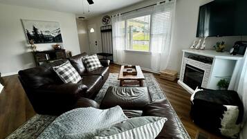 Smart TV, fireplace, table football, books