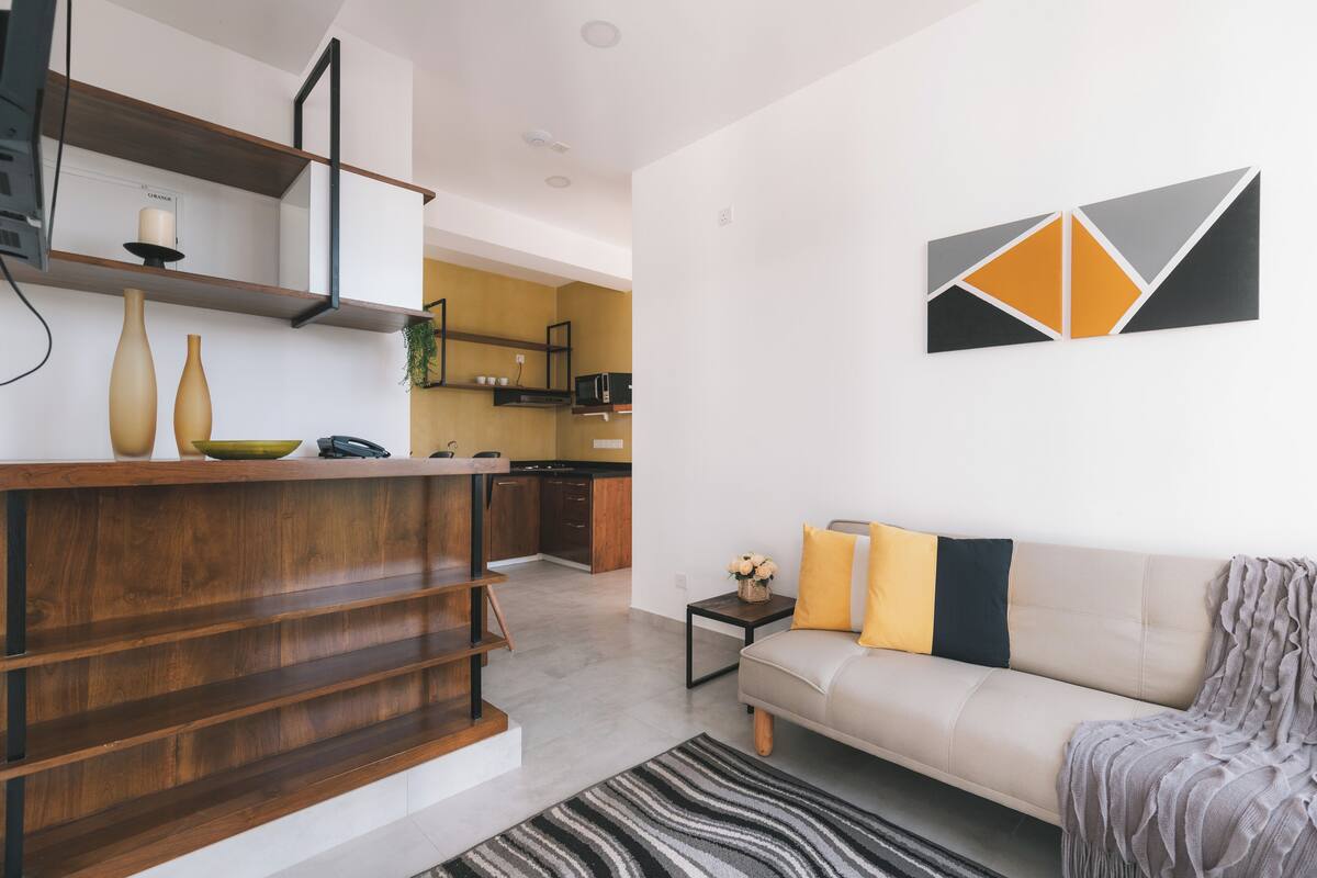 Luxury Apartment, 2 Bedrooms, Canal View | Living area | 42-inch LED TV with satellite channels