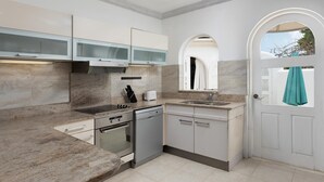 A modern kitchen with a built-in oven, dishwasher, and a sink.