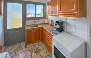 Fridge, stovetop, coffee/tea maker, cookware/dishes/utensils