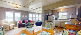 Cozy cottage with water views, spacious lawn, patio, & WiFi