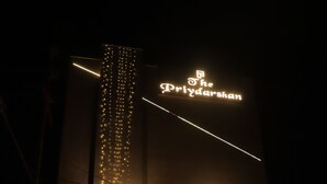 A hotel with 'The Priyadarshan' sign, 'Rooms', 'Banquets', and 'Restaurant' sections. - Hotel Priydarshan (Kanpur)