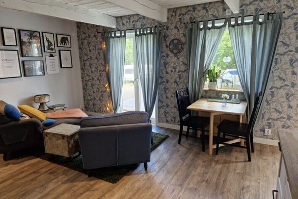 Open living room area with patio door access to the deck