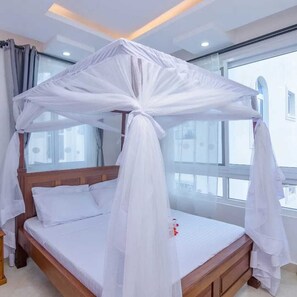 Deluxe Apartment, Balcony, Pool View | Individually decorated, individually furnished, free WiFi - Lux Suites Kijani Beach Apartments (Malindi)